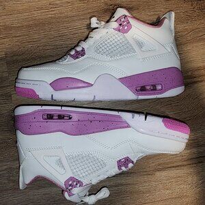 White and pink jordan 4s
